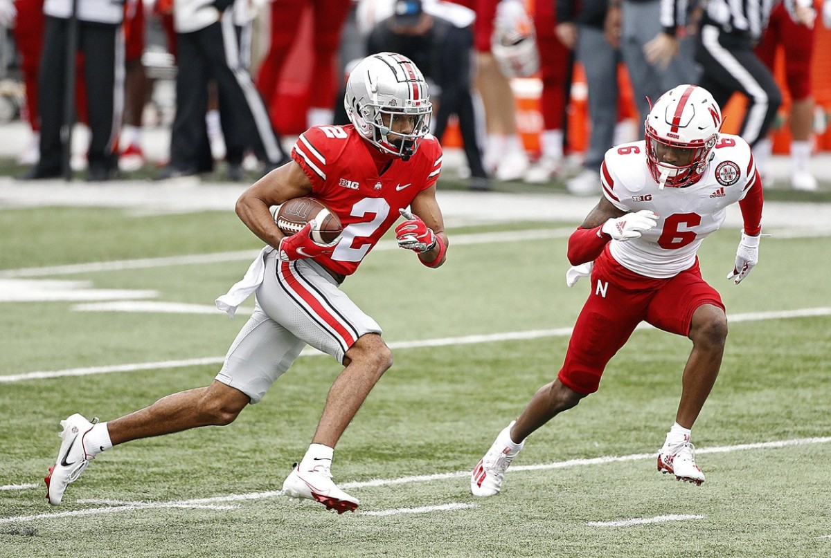 Ohio State receiver Chris Olave (2) heads up field after a catch against Nebraska. Kyle Robertson/Columbus Dispatch via Imagn Content Services, LLC